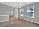 Living room with carpet floors, neutral paint and a view into the entryway at 3822 River Ridge Ct, Decatur, GA 30034