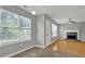 Living room features natural light, hardwood floors, and a fireplace at 3822 River Ridge Ct, Decatur, GA 30034