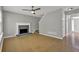 Open-plan living room boasts hardwood floors, a fireplace, and staircase access at 3822 River Ridge Ct, Decatur, GA 30034