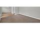 Open living room featuring plush carpet and an entrance to the dining room at 3822 River Ridge Ct, Decatur, GA 30034