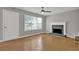 Living room showcases hardwood flooring and a gray brick fireplace at 3822 River Ridge Ct, Decatur, GA 30034