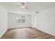 Basement features plank flooring, a bright window, and white walls at 4179 Westchester Ne Xing, Roswell, GA 30075