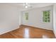 Bright bedroom with hardwood floors, two windows and white walls at 4179 Westchester Ne Xing, Roswell, GA 30075
