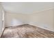 Bedroom with hardwood floors, neutral paint and natural light from one window at 4179 Westchester Ne Xing, Roswell, GA 30075
