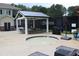 Outdoor hot tub with a cozy pavilion area, perfect for relaxation and entertaining guests at 4179 Westchester Ne Xing, Roswell, GA 30075
