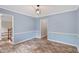 Living room with wood floors and staircase access at 4179 Westchester Ne Xing, Roswell, GA 30075