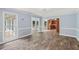 Spacious living room with abundant light and access to the kitchen at 4179 Westchester Ne Xing, Roswell, GA 30075