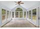 Bright sunroom surrounded by windows, offering natural light and views of the outdoors at 4179 Westchester Ne Xing, Roswell, GA 30075