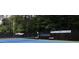Bright community tennis court offering space to play in a serene, wooded neighborhood at 4179 Westchester Ne Xing, Roswell, GA 30075