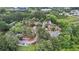 An aerial view showcases the townhome community nestled among mature trees and greenery at 49 Country Ct, Alpharetta, GA 30005