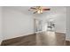 Bright and spacious living area with hardwood floors, natural light, and sliding glass door at 49 Country Ct, Alpharetta, GA 30005