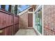 Brick patio with privacy fence and door at 49 Country Ct, Alpharetta, GA 30005