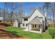 Spacious backyard with lush green lawn and the rear exterior of the home at 95 Old Town Rd, Dacula, GA 30019
