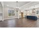 Modern eat-in kitchen with an island, stainless steel appliances, and hardwood floors at 95 Old Town Rd, Dacula, GA 30019
