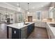 Modern kitchen with large island, stainless steel appliances, and plenty of cabinet space at 95 Old Town Rd, Dacula, GA 30019