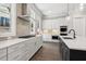 Modern kitchen featuring stainless steel appliances, white cabinetry, and a spacious island with sink at 95 Old Town Rd, Dacula, GA 30019
