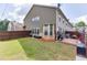 Large backyard featuring a grassy area, a patio space, and a privacy fence at , Lawrenceville, GA 30044