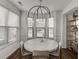 Bright dining area with a round table, ample natural light, and modern decor at , Lawrenceville, GA 30044