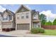 Beautiful two-story townhome featuring a brick exterior, a two-car garage, and well-maintained landscaping at , Lawrenceville, GA 30044
