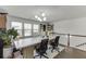 Bright home office features a large desk, hardwood floors, modern lighting and multiple windows for ample natural light at , Lawrenceville, GA 30044