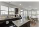 Kitchen with granite counters, stainless steel appliances, dark wood cabinets, and dining area at , Lawrenceville, GA 30044