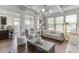 Open-concept living room with hardwood floors, modern furnishings, and a stylish lighting fixture at , Lawrenceville, GA 30044