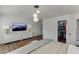Spacious main bedroom features ample closet space, hardwood floors, modern lighting and a tv to create a cozy retreat at , Lawrenceville, GA 30044