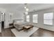 Bright main bedroom with modern lighting, hardwood floors and generous natural light creates a serene and comfortable retreat at , Lawrenceville, GA 30044