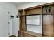 Mudroom with white refrigerator, wooden cabinets and drawers and white board wall calendar at , Lawrenceville, GA 30044