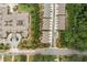 Aerial view showcasing community layout with tree-lined streets and sidewalks at 109 Camden Park Dr, Woodstock, GA 30188