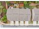 Rooftop view showcasing a community of townhomes with individual driveways at 109 Camden Park Dr, Woodstock, GA 30188