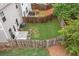 Aerial view showing a fenced backyard with patio and trees at 109 Camden Park Dr, Woodstock, GA 30188