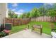 Landscaped backyard features a patio area with planting bed and fenced yard at 109 Camden Park Dr, Woodstock, GA 30188