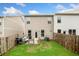Fenced backyard with a patio, grill, seating, and a small garden area at 109 Camden Park Dr, Woodstock, GA 30188