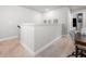 Upstairs hallway with carpet, white walls, and a desk in the corner at 109 Camden Park Dr, Woodstock, GA 30188