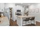 Well-lit kitchen featuring stainless steel appliances and a kitchen island with bar stool seating at 109 Camden Park Dr, Woodstock, GA 30188