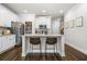 Stylish kitchen featuring white cabinets, stainless steel appliances, and a kitchen island with bar stool seating at 109 Camden Park Dr, Woodstock, GA 30188