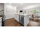 Open kitchen area featuring stainless steel appliances, a kitchen island, and a connected dining area at 109 Camden Park Dr, Woodstock, GA 30188