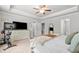 Main bedroom with crown molding, ceiling fan, walk-in closet, and home gym at 109 Camden Park Dr, Woodstock, GA 30188