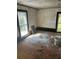 Empty bedroom with hardwood floors, window with natural light and dark trim at 119 E Johnson St, Temple, GA 30179