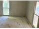 Empty bedroom with natural light streaming in at 119 E Johnson St, Temple, GA 30179