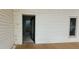 Open doorway featuring access to interior staircase and back yard at 119 E Johnson St, Temple, GA 30179