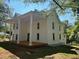 Two-story home featuring a large front porch supported by stately columns at 119 E Johnson St, Temple, GA 30179