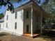 Exterior view of a two-story home with white siding and a large covered porch with classic columns at 119 E Johnson St, Temple, GA 30179