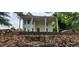 Two-story home featuring a large front porch supported by stately columns at 119 E Johnson St, Temple, GA 30179