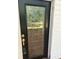Detailed front door featuring a large glass panel with decorative mullions at 119 E Johnson St, Temple, GA 30179