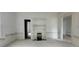 Spacious Living room featuring an antique fireplace and multiple doorways at 119 E Johnson St, Temple, GA 30179