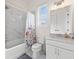 Bathroom featuring marble-style tile, a shower-tub combo, and a modern vanity with a sink at 3330 Carswell Bnd, Cumming, GA 30028