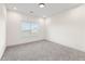 A clean and spacious bedroom with carpet and a window providing ample natural light at 3330 Carswell Bnd, Cumming, GA 30028