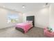 Bright bedroom with a plush bed, soft carpet, and a window offering natural light at 3330 Carswell Bnd, Cumming, GA 30028